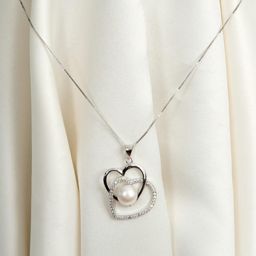 Silver heart and pearl pendant